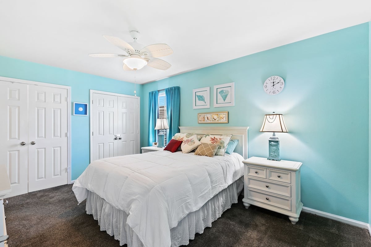 Second bedroom with a king bed and adjoining bathroom.