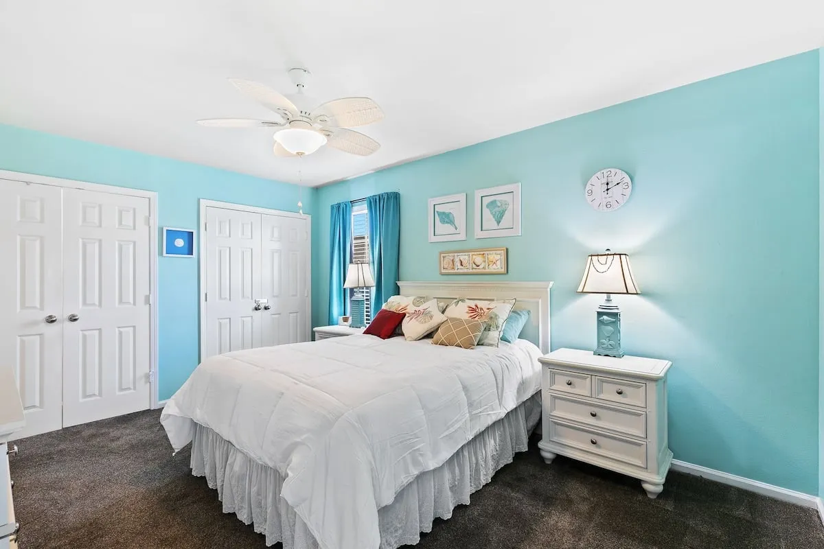 Second bedroom with a king bed and adjoining bathroom.